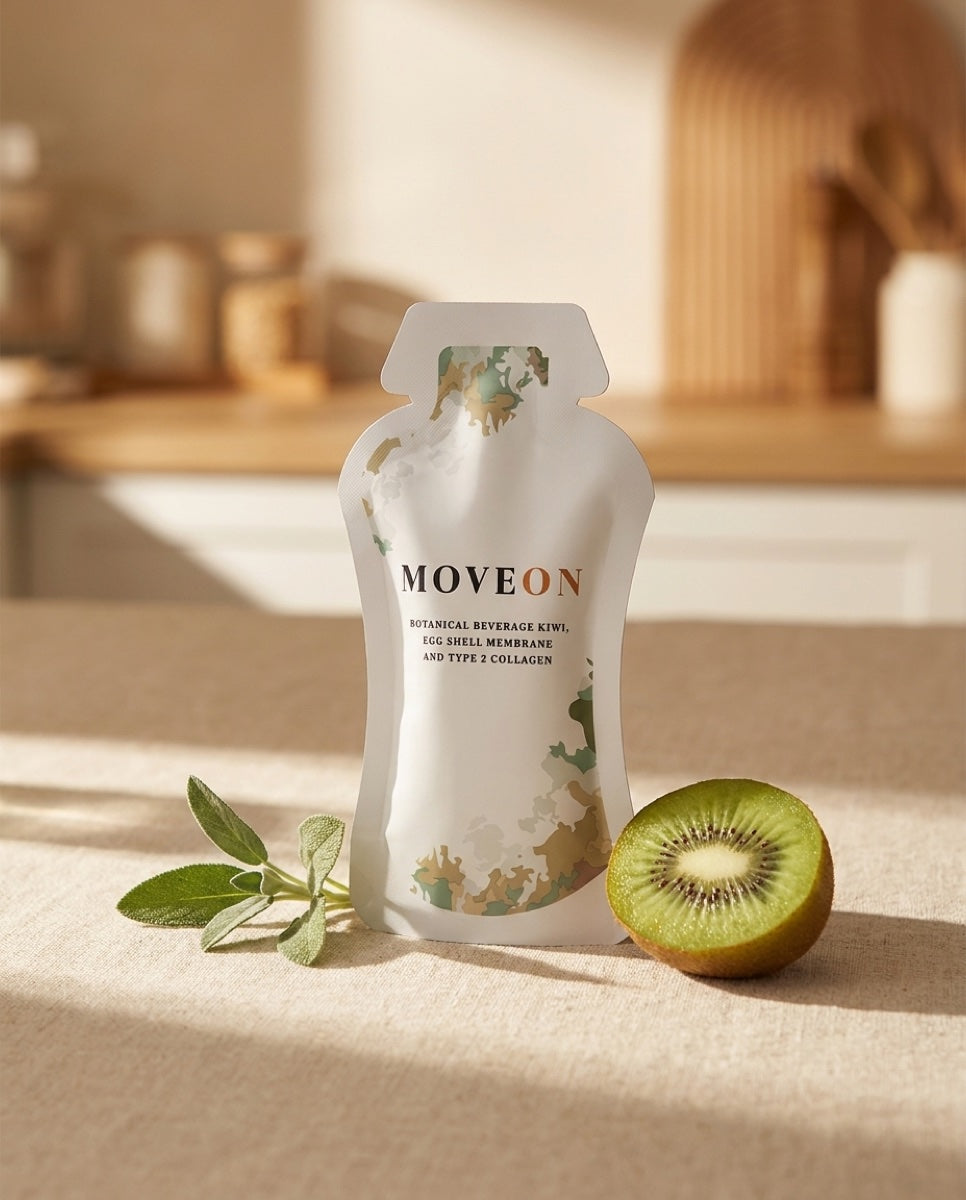 A MoveOn liquid sachet on warm linen beside fresh kiwi