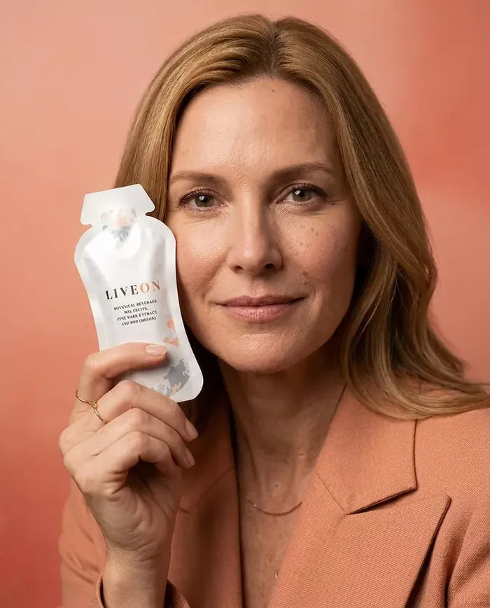 A woman holding a LiveOn sachet
